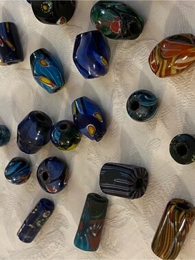 A mix of 38 non- glossed African beads and more modern glass versions.